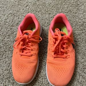 Nike free run orange tennis shoes
